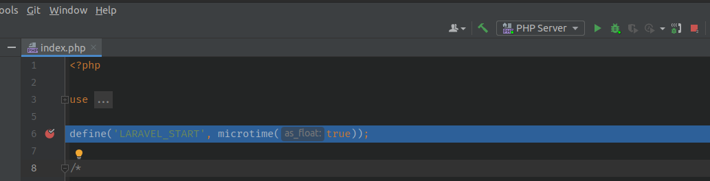 Alt: print de tela de edição do editor com o arquivo “index.php” aberto e com um círculo preenchido em vermelho na linha 06 e toda a linha marcada em azul o script parado no ponto demarcado pelo breakpoint esperando a liberação do restante da execução.