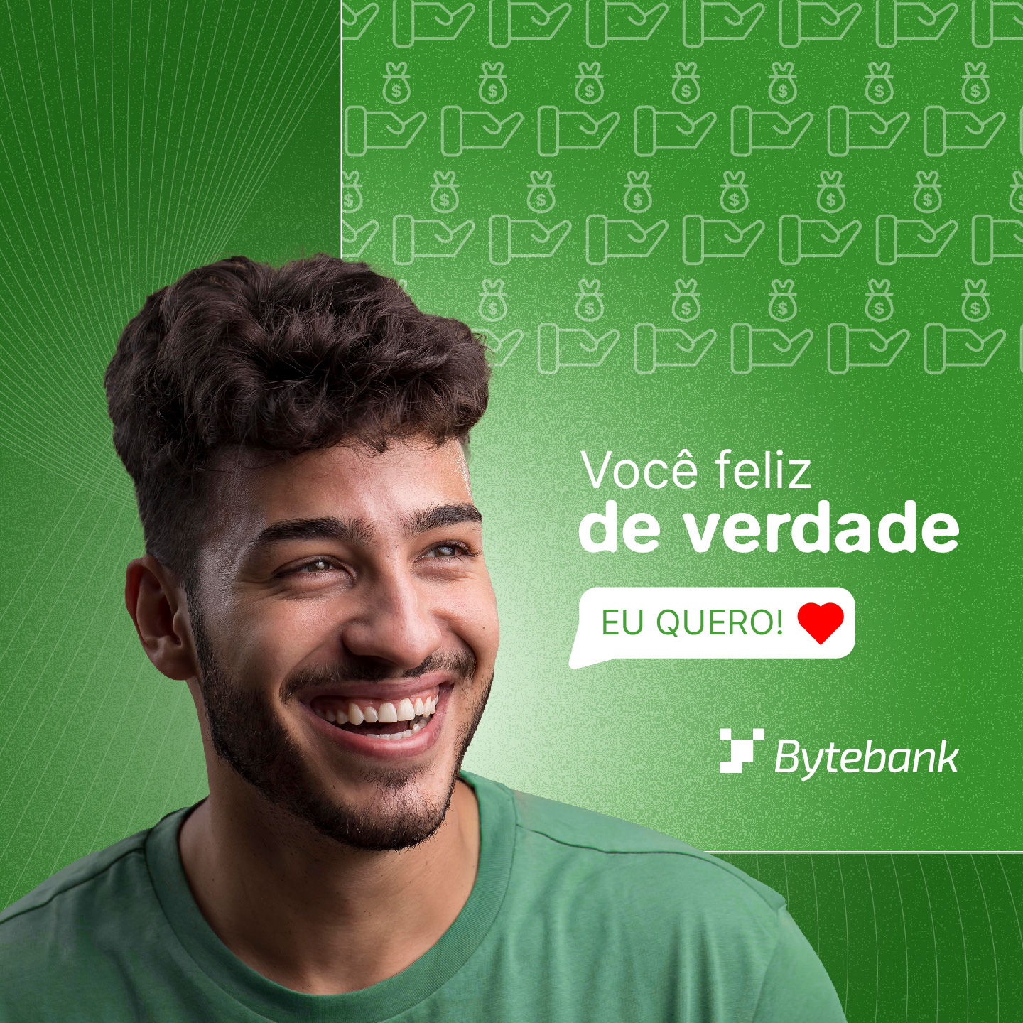 Imagem de um banner para publicação em redes sociais. Nele, há diversos grafismos, além da fotografia de um modelo sorrindo e dos dizeres “Você feliz de verdade” e “Eu quero”, acompanhados do logo da empresa Bytebank.