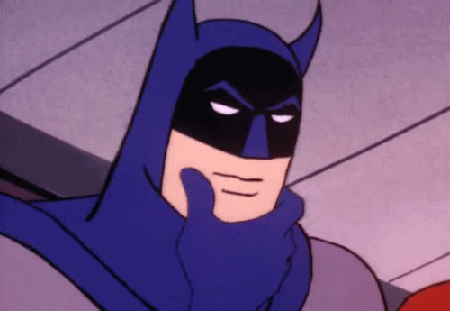 A animação no arquivo gif apresenta o dorso do super-herói Batman.Ele está com uma máscara com orelhas de morcego, e seu rosto está virado para o sentido direito da tela. Sua expressão é séria e ele toca o queixo com as pontas do dedo